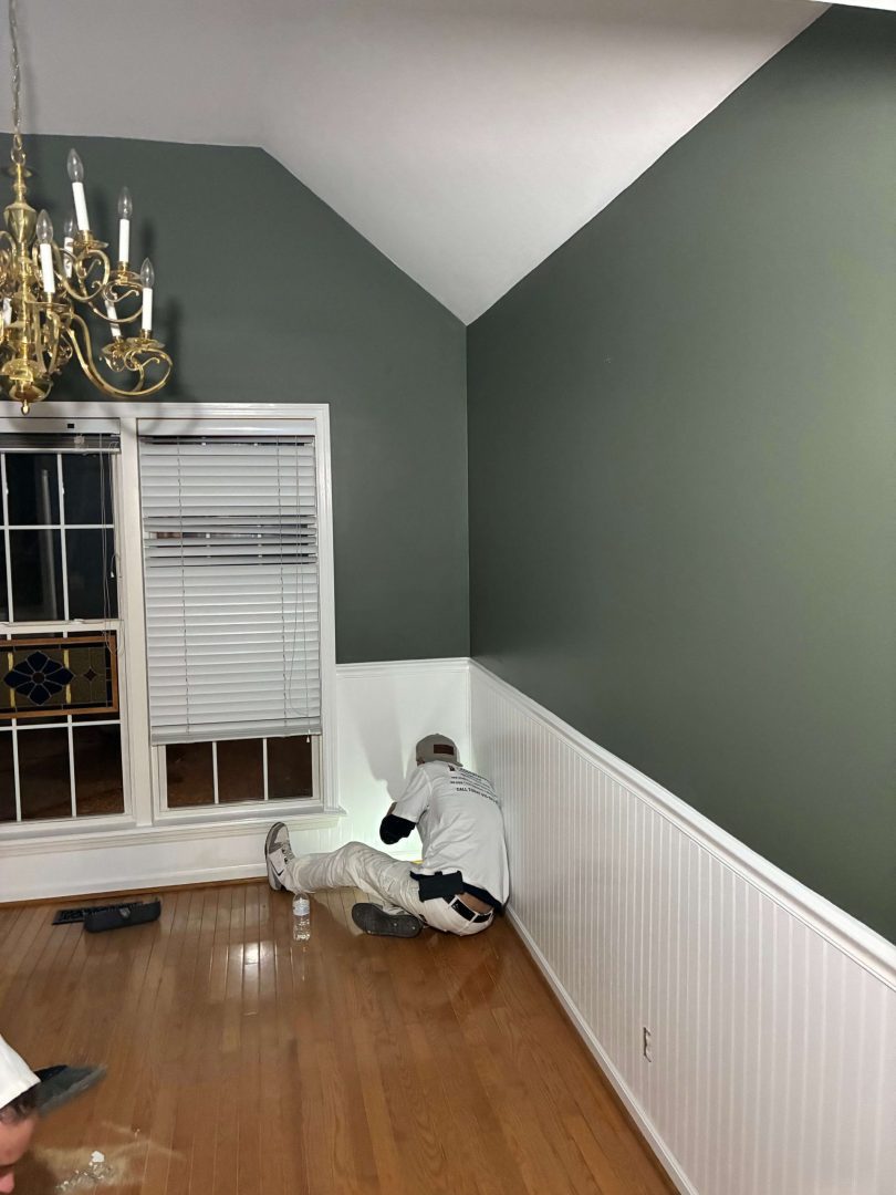 Fresh green walls and bright white trim in a residential interior
